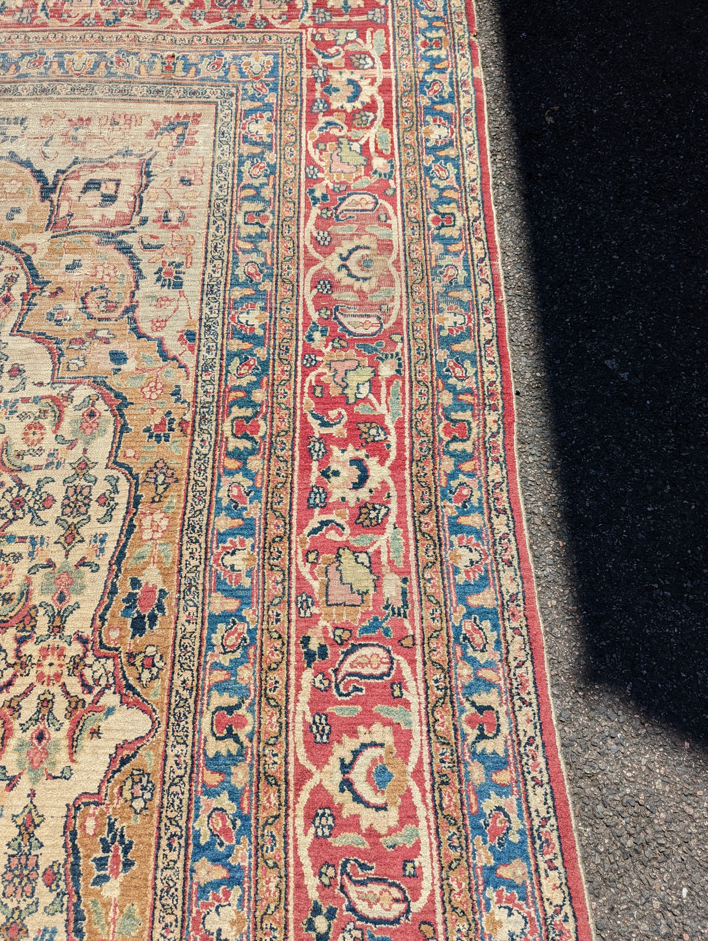 An Isfahan ivory ground carpet, 432 x 330cm